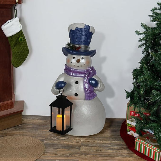 Alpine Corporation SKY562L-TM Lavender Winter Snowman Holding Lantern Statue with Warm White Flashing LED Candle, 3 Feet Tall, Indoor/Outdoor Holiday Decoration